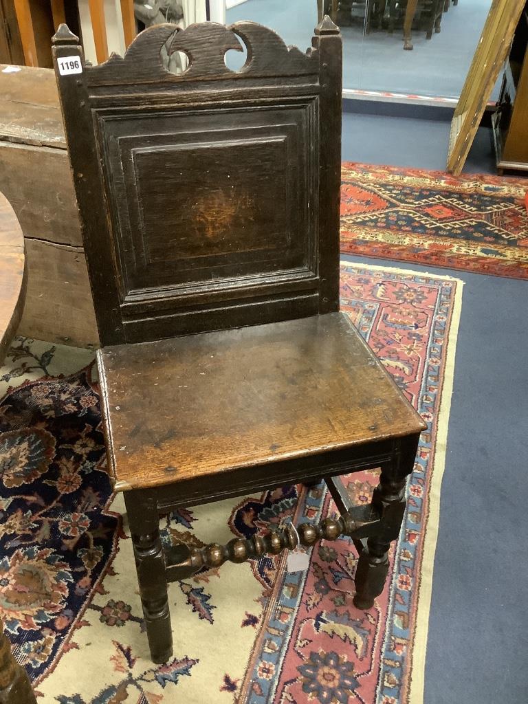 A 17th century oak back stool with bobbin front stretcher, width 47cm, depth 38cm, height 96cm